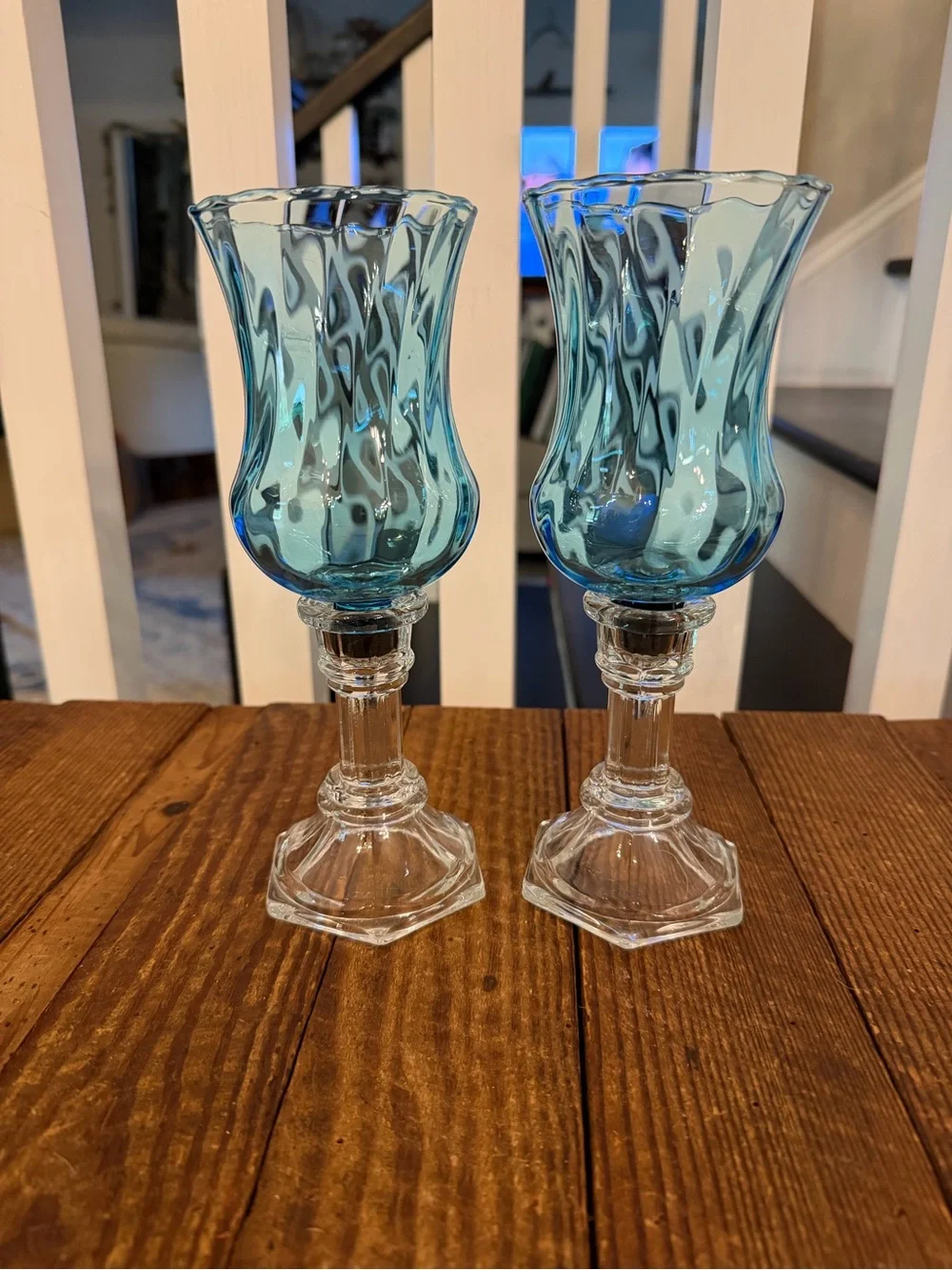 Pair of vintage HOMCO blue optic swirl votive holders with clear glass base